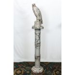 A marble Falcon and plinth, 46cm and 1m