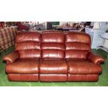 A La-Z-Boy red/brown three seater leather sofa, in very good condition