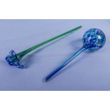 Blown glass plant watering stake and an iris flower