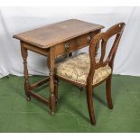 Small oak table with two drawers and a dining chair