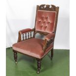 Edwardian mahogany armchair with turned legs and velvet upholstery