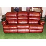 A La-Z-Boy red/brown three seater leather sofa, in very good condition