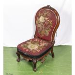 A vintage Lloyd Loom style cane nursing chair