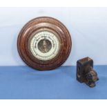 A small barometer and a matchbox holder