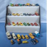 A collection of vintage Corgi, Dinky and other play worn die cast vehicles