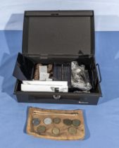 A cash box with old obsolete vintage coins and notes