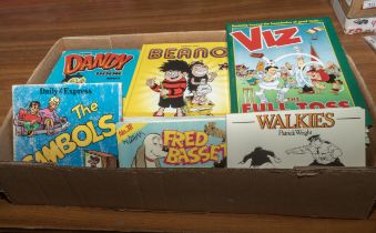 A box containing annuals, Beano, Dandy, Viz and others
