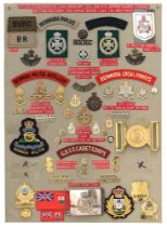 52 Bermuda military and police badges etc. Board with good display of metal and cloth badges, 2