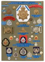 39 British Guiana military and police badges etc. Board with good display of metal and cloth badges,