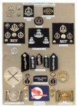 44 Nigeria Police badges etc. Board with good display of metal and cloth badges, 2 waist belt