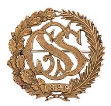 Sudan Civil Service pagri badge. Good scarce die-cast gilt oak and palm sprays with SCS cypher to