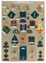 58 Uganda Rifles and 4th King's African Rifles badges etc. Board with good display of metal and