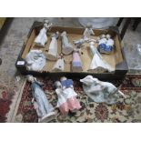 A group of Lladro and Nao porcelain figurines and animal groups to include a Nao figure of two choir