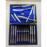 A cased set of silver handled knives and forks, comprising of six knives and six forks, along with