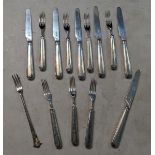 A group of thirteen William IV silver knives and forks, comprising of six knives and seven forks,