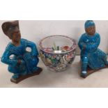 A 20th century goldfish bowl together with two panted terracotta figures Location: