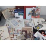 Stamps - An RAF folder of Cupro nickel coin covers, three albums containing worldwide stamps, stamps