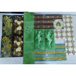 A collection of 31 Art Nouveau tiles to include Minton style floral examples, Summer and Winter,