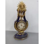A replica Marie-Antoinette clock from the Victoria & Albert Museum, in a blue porcelain case with