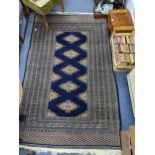 A Bokhara rug with gulls on a blue ground, 206cm x 127cm Location: