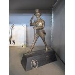 A silver plated figurine of Johnnie Walker (Scotch Whisky) mounted on a rectangular base, 21.5cm