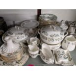 A Crown Staffordshire Winter Roses pattern dinner service with tureen, plates, bowls, tea and coffee