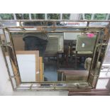 A gilt framed wall mirror with mirrored panels to the border, rectangular plate glass, 62cm x 76.5cm