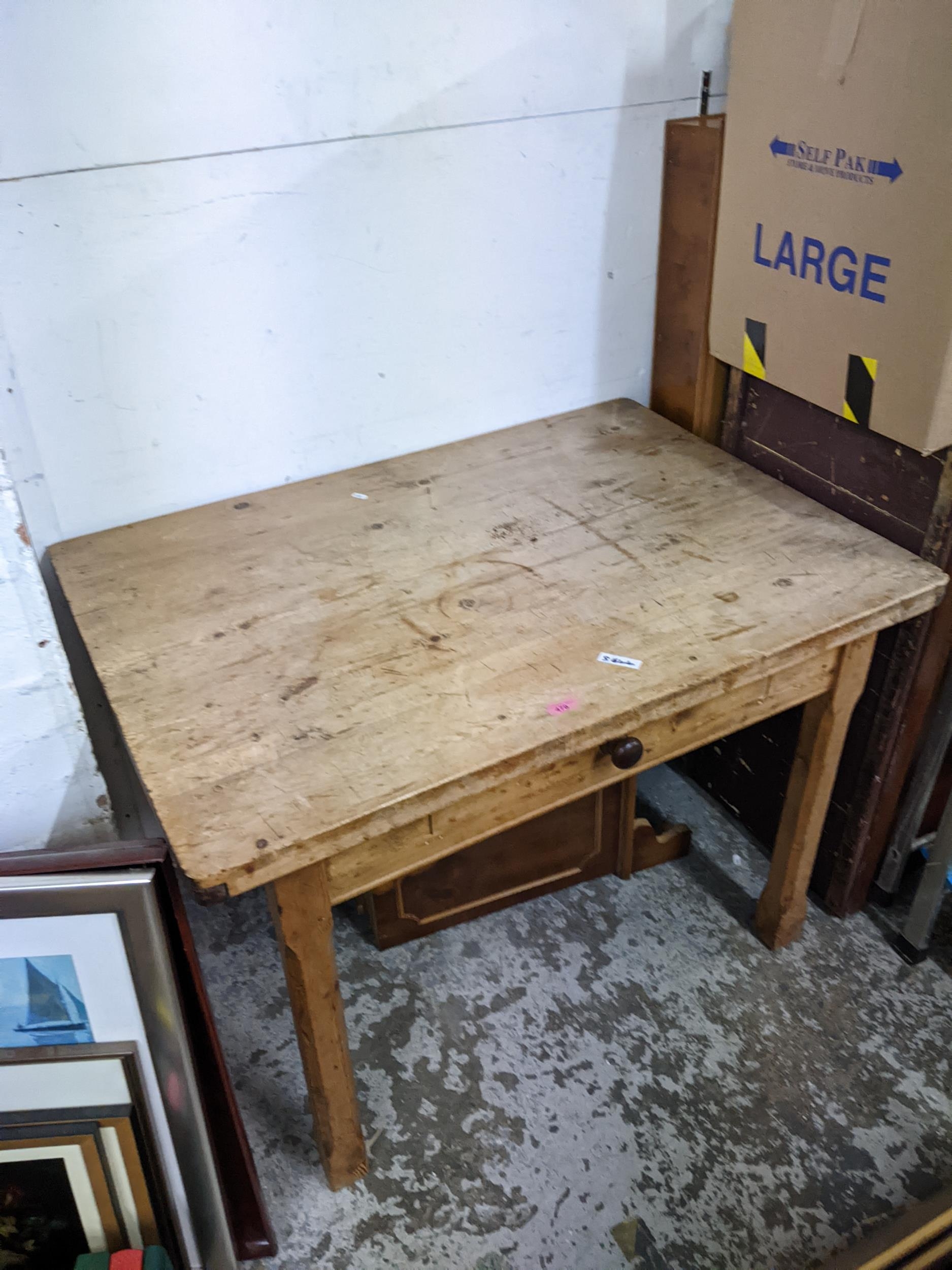 An early 20th century pine kitchen table with a drawer 75cm h x 105cm w Location: