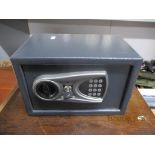 A security safe with key, 31cm x 20cm Location:G