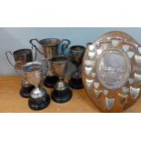 Four silver trophies and a silver plated trophy and a plaque, approx 798g Location: A4F