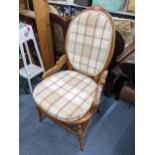 An early 20th century French oval back chair with cane seat and turned legs Location: