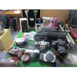 A quantity of Digital and vintage film cameras to include a Sony OC200, Olympus Trip 35 and OM10,