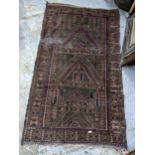An Afghanistan prayer rug, with three panels, 147cm x 85cm Location: