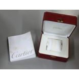 A red Cartier watch box, along with Cartier booklet Location: