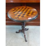 A Victorian walnut games table with a barley twist column, on a tripod base A/F Location: