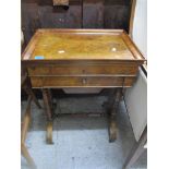 An early Victorian walnut work table, the top with framed moulded edge, hinged to reveal a