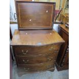 A reproduction serpentine fronted chest of three drawers on bracket feet 76cm x 69.5cm x 46cm, along