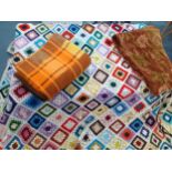 A 1970's knitted and crotchet woollen patchwork throw, 3m x 2.5m, having a white border A/F,