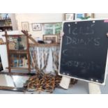 A vintage lot to include two mirrors, a wooden bead door curtain, a novelty chalk sign with