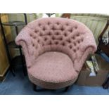 An early 20th century button back upholstered tub chair on tapering legs and castors Location:
