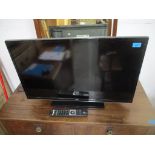 A JVC 31" flat screen TV with remote Location: