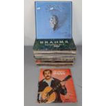 A collection of LP records to include Eagles, Georges Brassens, and classical examples, an