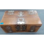 A late 18th/early 19th century teak strong box having ornate strapwork,