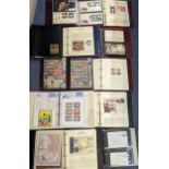 A group of 14 albums of First Day covers, coin covers, and stamps, along with loose world stamps