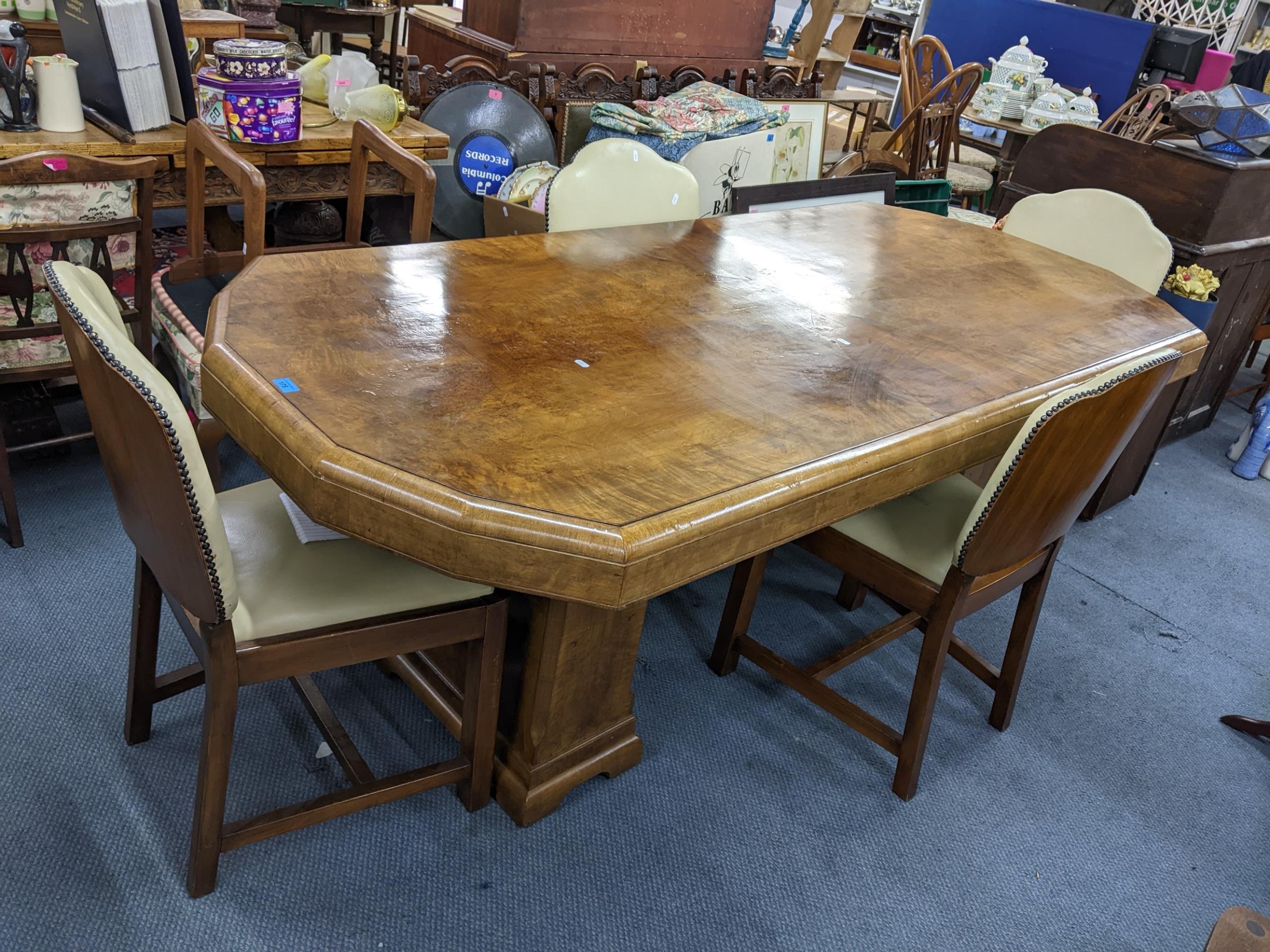 An Art Deco walnut veneered Epstein style octagonal topped twin pedestal dining table, 77.5cm h x