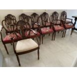 A set of twelve mid 20th century mahogany framed shield shaped back dining chairs comprising six