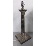 A silver plated table lamp having a Corinthian column, stepped base and gadrooned border, 43cm