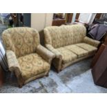 An Art Deco walnut veneered and floral upholstered sofa with two matching armchairs, 82cm h x 86cm w