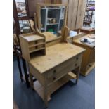 A Victorian pine dressing table with swing mirror, four drawers and shelf below, 143cm h x 91.5cm