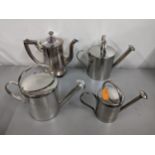 Three Kenneth Turner silver plated jugs in the former cans together with a small teapot retailed